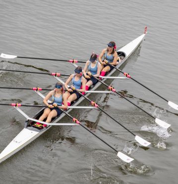 Rowing quad scull on river